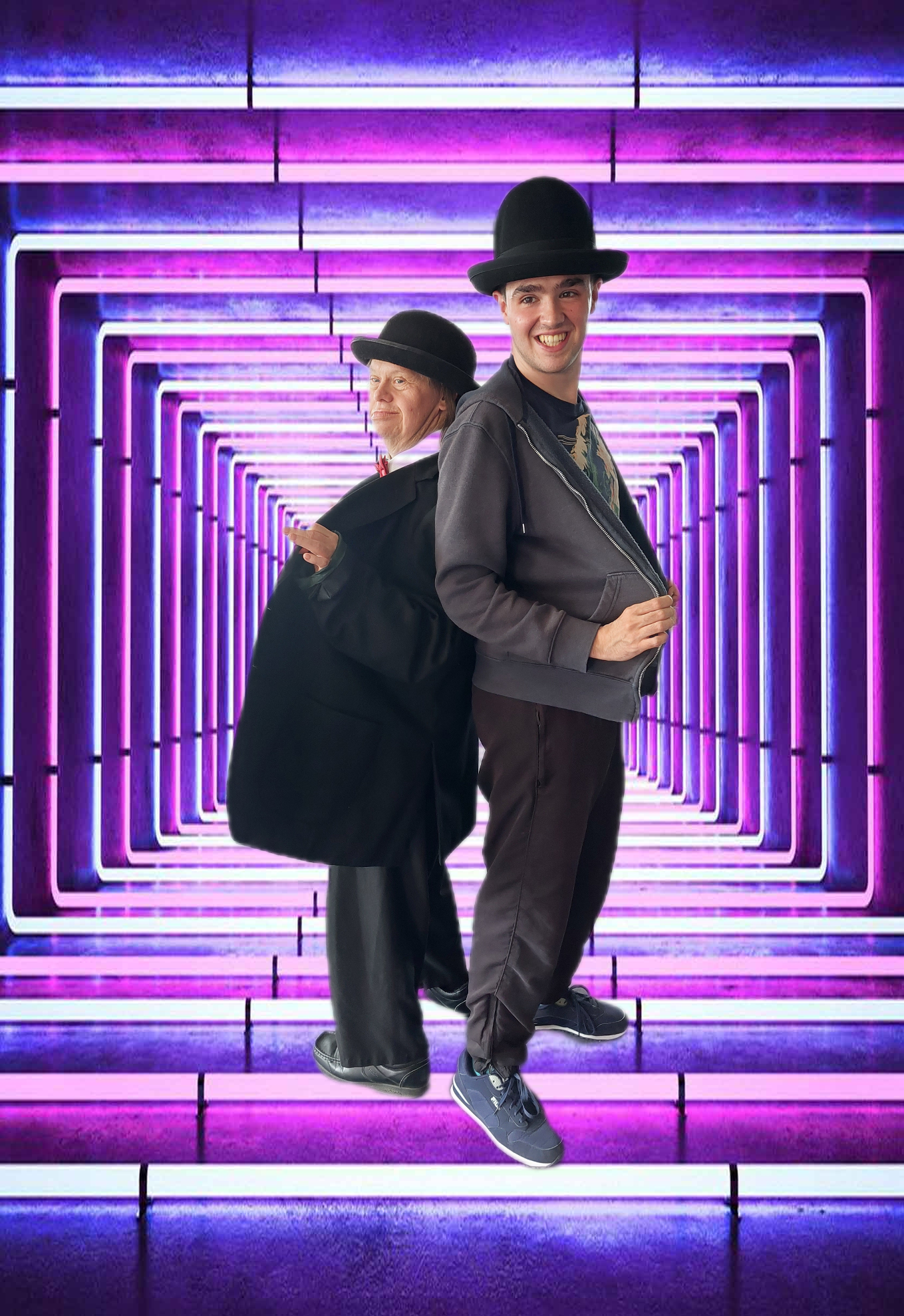 Actors dressed as Laurel and Hardy with a neon tunnel in background
