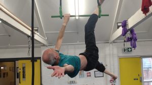 Man on aerial trapeze