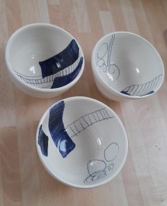 3 white and blue ceramic bowls