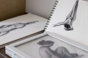 Sketch books with life drawings in them