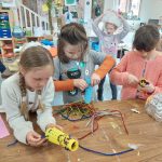 Young people in art class making craft work