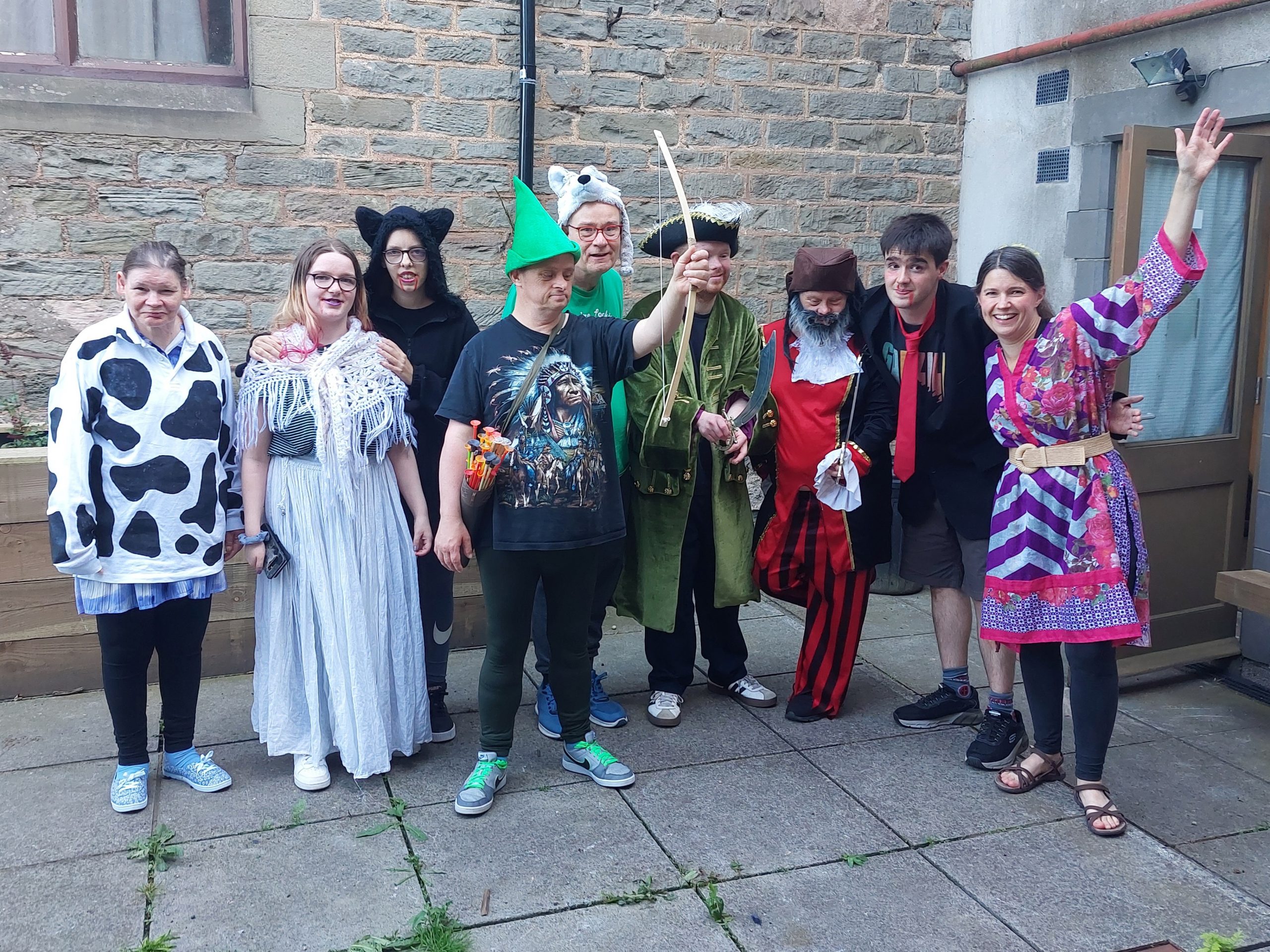 A group of drama students dressed up in pantomime clothing 