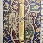 A decorative illuminated manuscript page featuring a gold vertical bar in the center with two stylized, spotted leopards or similar large cats intertwined around it. The background is divided into red and green sections, with intricate gold and blue floral and vine motifs surrounding the animals and the central gold bar.